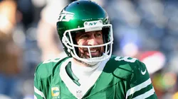 Aaron Rodgers #8 of the New York Jets smiles before a game against the Los Angeles Rams at MetLife Stadium on December 22, 2024 in East Rutherford, New Jersey.