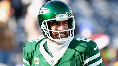 Aaron Rodgers #8 of the New York Jets smiles before a game against the Los Angeles Rams at MetLife Stadium on December 22, 2024 in East Rutherford, New Jersey.