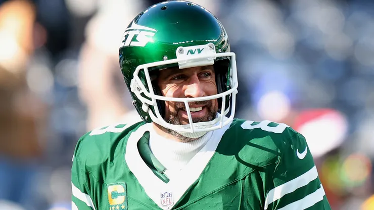 Aaron Rodgers #8 of the New York Jets smiles before a game against the Los Angeles Rams at MetLife Stadium on December 22, 2024 in East Rutherford, New Jersey.
