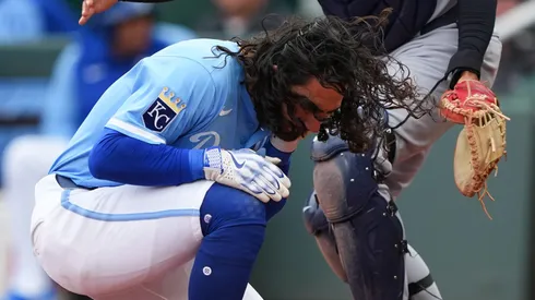 Jonathan India #6 of the Kansas City Royals is hit by a Cleveland Guardians during the ninth inning at Kauffman Stadium on March 30, 2025 in Kansas City, Missouri.