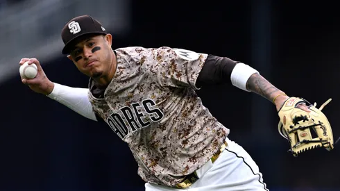 Manny Machado #13 of the San Diego Padres throws to first base during the eighth inning against the Atlanta Braves at Petco Park on March 30, 2025 in San Diego, California.