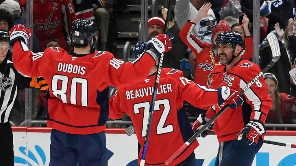 Alex Ovechkin #8 of the Washington Capitals celebrates with his teammates after scoring a goal against the Buffalo Sabres during the third period at Capital One Arena on March 30, 2025 in Washington, DC.