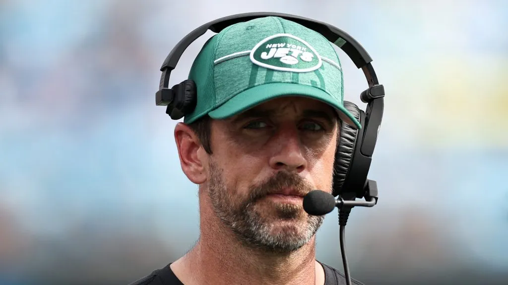 Aaron Rodgers watching a game from the sideline.