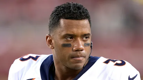 Russell Wilson looks on from the sidelines of a preseason game against the San Francisco 49ers during the fourth quarter at Levi's Stadium on August 19, 2023 in Santa Clara, California.