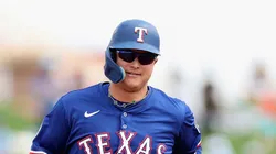 Joc Pederson #4 of the Texas Rangers rounds the bases after hitting a three-run home run against the Cincinnati Reds during the first inning of the MLB game at Surprise Stadium on March 12, 2025 in Surprise, Arizona.
