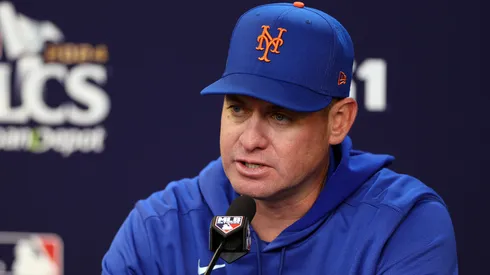 Manager Carlos Mendoza #64 of the New York Mets speaks to the media.
