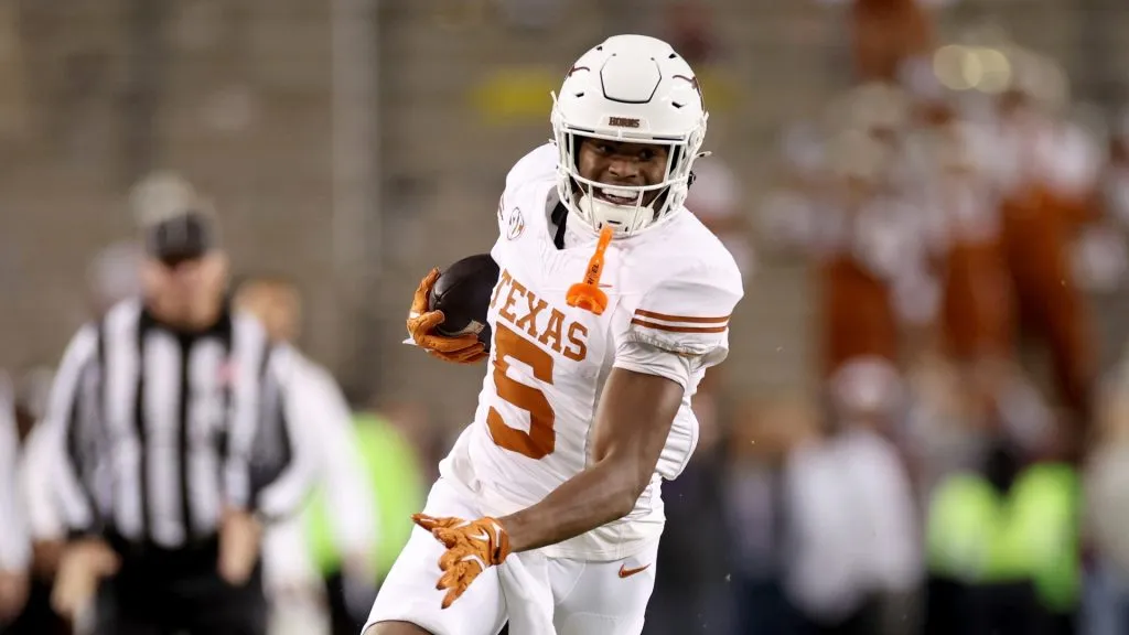 Ryan Wingo #5 of the Texas Longhorns runs after a reception in the first half against the Texas A&amp;M Aggies at Kyle Field on November 30, 2024 in College Station, Texas.