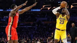 LeBron James #23 of the Los Angeles Lakers shoots a 3-point basket to score his 50,002 NBA regular season and playoff career points during the first half in 2025.