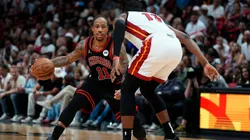 DeMar DeRozan #11 of the Chicago Bulls dribbles the ball against Bam Adebayo #13 of the Miami Heat in the fourth quarter during the Play-In Tournament in 2024.