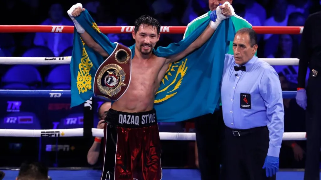 Janibek Alimkhanuly of Kazakhstan poses with the referee after defeating Rob Brant in a middleweight bout at Virgin Hotels Las Vegas on June 26, 2021 in Las Vegas, Nevada. Alimkhanuly won by TKO after the eighth round. Photo by Steve Marcus/Getty Images)