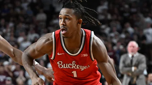 Meechie Johnson Jr. #1 of the Ohio State Buckeyes drives toward the basket at Zhuric Phelps #1 of the Texas A&M Aggies defends during the second half at Reed Arena on November 15, 2024 in College Station, Texas.
