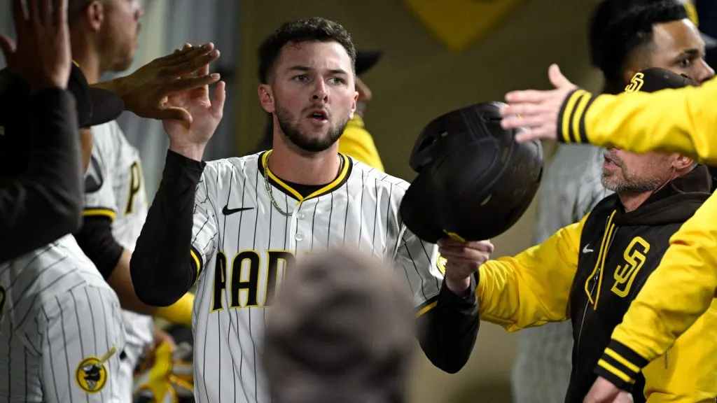 Jackson Merrill #3 of the San Diego Padres is congratulated in the dugout after scoring a run during the sixth inning against the Cleveland Guardians at Petco Park on April 01, 2025 in San Diego, California. (Photo by Orlando Ramirez/Getty Images)