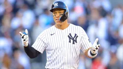 Aaron Judge #99 of the New York Yankees reacts after hitting a an RBI double in the seventh inning against the Milwaukee Brewers on Opening Day at Yankee Stadium on March 27, 2025 in New York City.