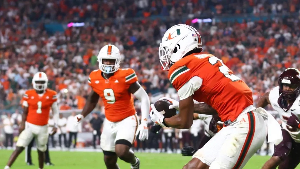 Isaiah Horton #2 of the Miami Hurricanes catches a touchdown pass from Cam Ward #1 during the fourth quarter of the game against the Virginia Tech Hokies at Hard Rock Stadium on September 27, 2024 in Miami Gardens, Florida.