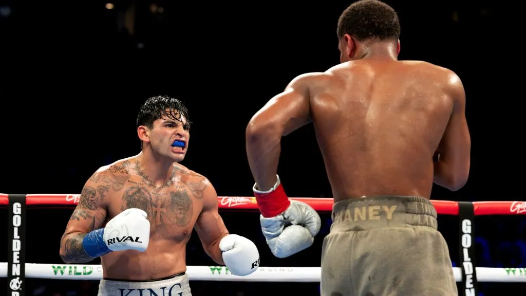 Ryan Garcia (white trunks) reacts against Devin Haney (gray trunks) during their WBC Super Lightweight title bout at Barclays Center on April 20, 2024 in New York City. (Photo by Al Bello/Getty Images)