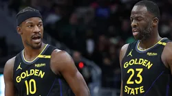 Jimmy Butler #10 and Draymond Green #23 of the Golden State Warriors walk backcourt during a game against the Milwaukee Bucks.