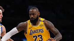 LeBron James #23 of the Los Angeles Lakers dribbles the ball during the first half of a game against Brandin Podziemski #2 of the Golden State Warriors