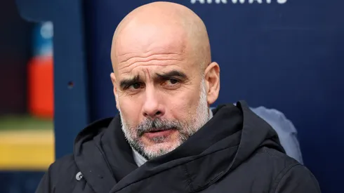 Pep Guardiola, Manager of Manchester City, looks on prior to the Premier League match between Manchester City FC and Brighton & Hove Albion FC at Etihad Stadium on March 15, 2025 in Manchester, England.
