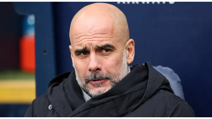 Pep Guardiola, Manager of Manchester City, looks on prior to the Premier League match between Manchester City FC and Brighton & Hove Albion FC at Etihad Stadium on March 15, 2025 in Manchester, England.