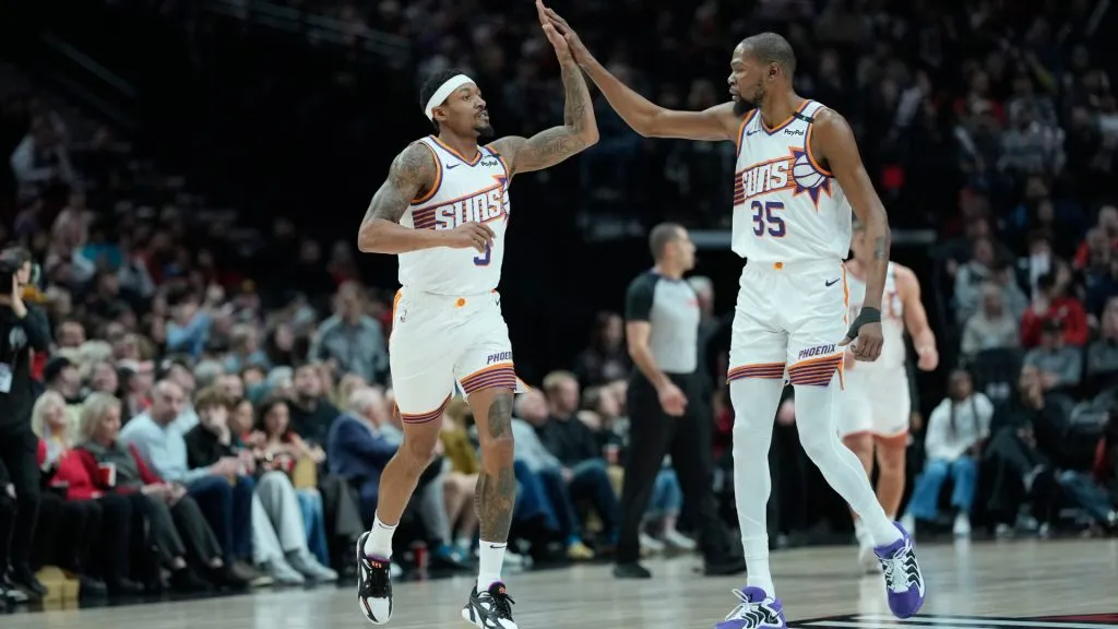 Bradley Beal #3 and Kevin Durant #35 of the Phoenix Suns high five during the first half at Moda Center. (Soobum Im/Getty Images)