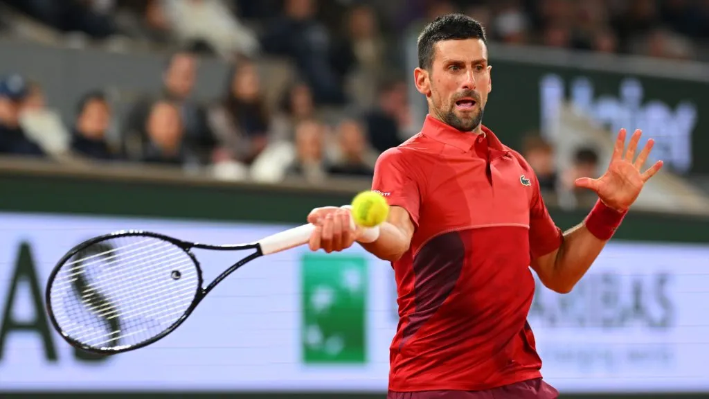 Novak Djokovic of Serbia plays a forehand against Lorenzo Musetti during the 2024 French Open at Roland Garros. (Clive Mason/Getty Images)