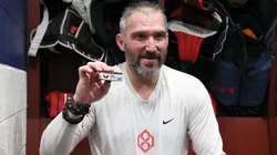 Alex Ovechkin #8 of the Washington Capitals holds the puck from his 894th career goal scored in the locker room after defeating the Chicago Blackhawks at Capital One Arena on April 04, 2025 in Washington, DC. Ovechkin's goal ties him with Wayne Gretzky for the all-time goal scoring record.