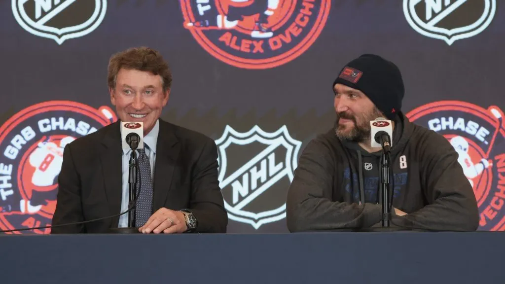 Wayne Gretzky and Alex Ovechkin #8 of the Washington Capitals speak with the media following the game against the Chicago Blackhawks at Capital One Arena on April 04, 2025 in Washington, DC. (Photo by Bruce Bennett/Getty Images)