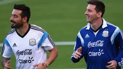 Ezequiel Lavezzi and Lionel Messi of Argentina run during a training session at Cidade do Galo on June 26, 2014.