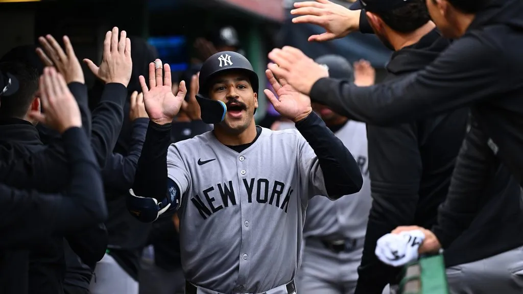 Trent Grisham #12 of the New York Yankees celebrates with teammates in the dugout