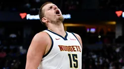 Nikola Jokic #15 of the Denver Nuggets reacts after making a shot in the first half against the Minnesota Timberwolves at Ball Arena on April 1, 2025 in Denver, Colorado.