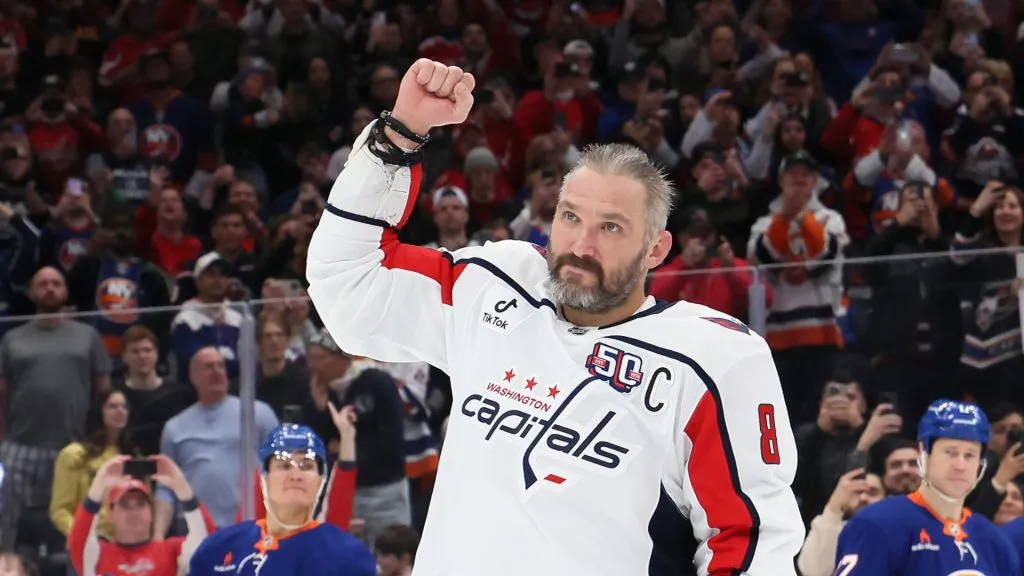 Alex Ovechkin #8 of the Washington Capitals celebrates after scoring his 895th career goal during the second period against the New York Islanders at UBS Arena on April 06, 2025 in Elmont, New York. Ovechkin's goal passes Wayne Gretzky's 894 goals to become the NHL all-time goal-scoring leader.