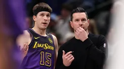Austin Reaves #15 of the Los Angeles Lakers and head coach JJ Redick talk during the second quarter against the Dallas Mavericks at American Airlines Center on January 07, 2025 in Dallas, Texas.