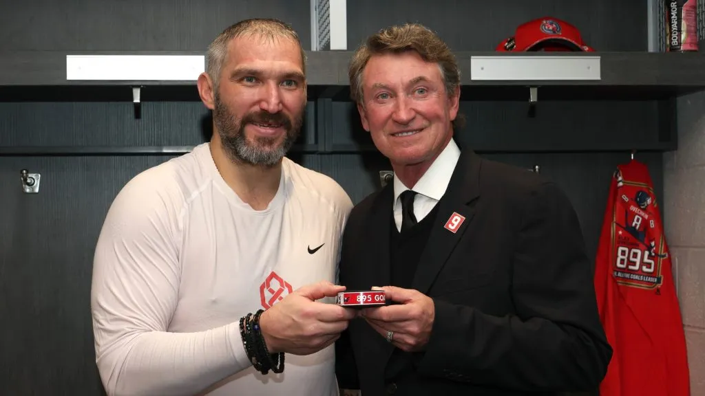 Alex Ovechkin and Wayne Gretzky pose for a photograph in the Washington Capitals’ locker room after Ovi broke the NHL goals record with his 895th career goal on April 6, 2025 at UBS Arena.