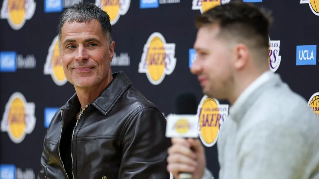 Rob Pelinka, general manage of the Los Angeles Lakers, looks on as Luka Doncic of the Los Angeles Lakers speaks during a press conference on February 04, 2025. (Source: Harry How/Getty Images)