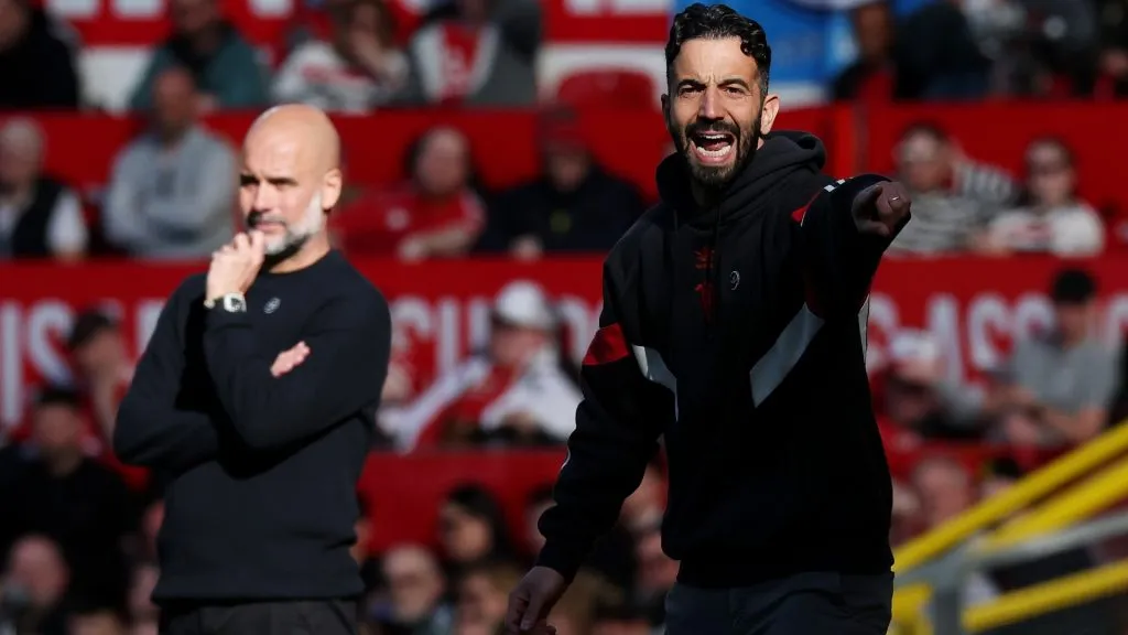 Ruben Amorim, Manager of Manchester United, gestures as Pep Guardiola, Manager of Manchester City, looks on during the Premier League match in 2025. (Source: Michael Steele/Getty Images)