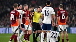 Referee Orel Grinfeeld reacts as Myles Lewis-Skelly of England goes down with an injury during the FIFA World Cup 2026 European Qualifier between England and Latvia in 2025.