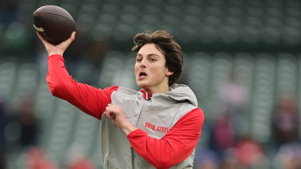Julian Sayin #10 of the Ohio State Buckeyes warms up prior to the game against the Northwestern Wildcats at Wrigley Field on November 16, 2024 in Chicago, Illinois.