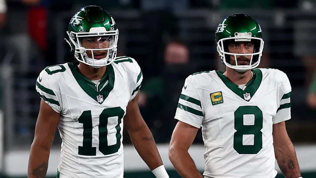 Aaron Rodgers #8 and Allen Lazard #10 of the New York Jets take the field in the first quarter against the Buffalo Bills at MetLife Stadium on September 11, 2023 in East Rutherford, New Jersey.