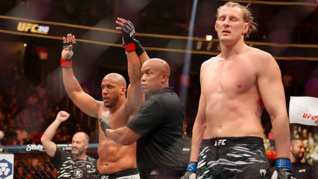 Ciryl Gane of France celebrates after his victory by split decision against Alexander Volkov of Russia in a heavyweight fight during UFC 310 at T-Mobile Arena on December 07, 2024. (Source: Steve Marcus/Getty Images)