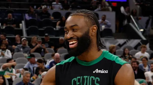 Chris Paul #3 of the San Antonio Spurs greets Jaylen Brown #7 of the Boston Celtics before the start of their game