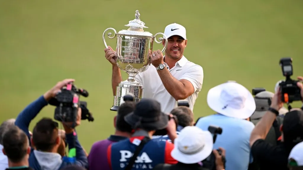 Champion Brooks Koepka holds The Wanamaker Trophy after the final round of the PGA Championship at Oak Hill Country Club on Sunday, May 21, 2023. (Source: Ross Kinnaird/Getty Images)