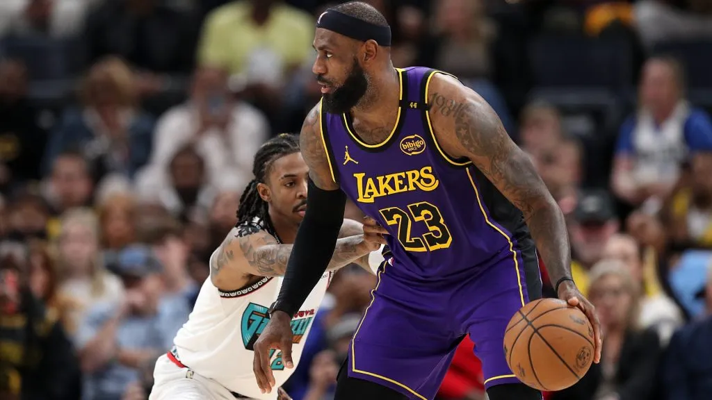 LeBron James #23 of the Los Angeles Lakers handles the ball against Ja Morant #12 of the Memphis Grizzlies during the second half at FedExForum. (Justin Ford/Getty Images)