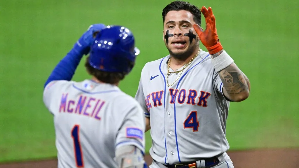 Francisco Alvarez #4 (R) of the New York Mets is congratulated by Jeff McNeil #1 after hitting a solo home run during the sixth inning of a baseball game against the San Diego Padres at Petco Park on July 8, 2023 in San Diego, California. (Photo by Denis Poroy/Getty Images)