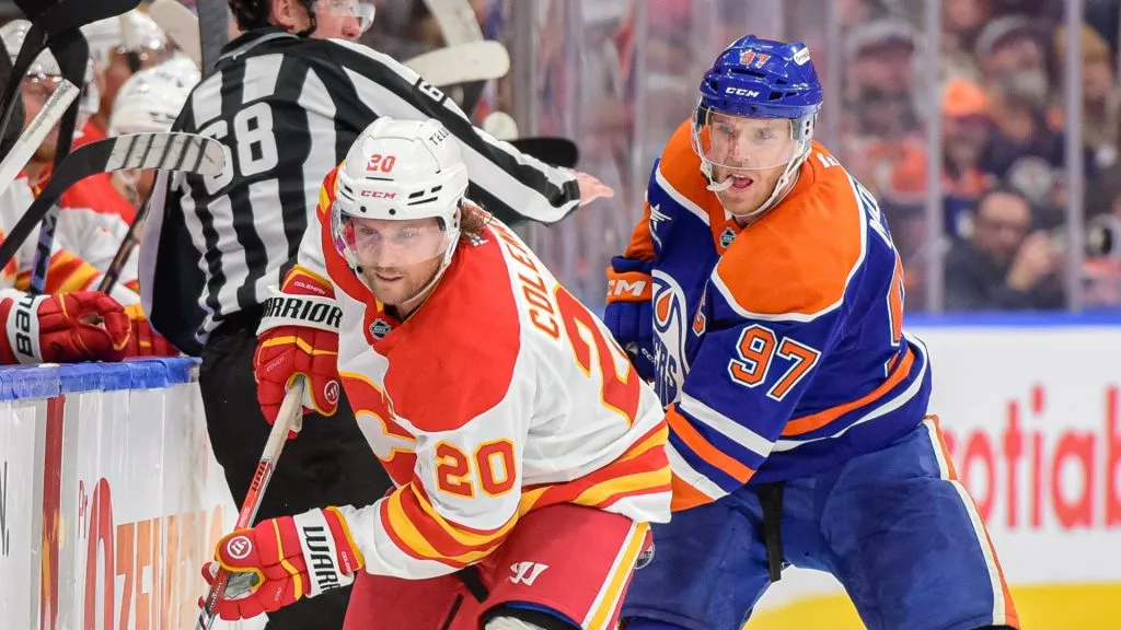 Blake&nbsp;Coleman #20 of the Calgary Flames battles against Connor&nbsp;McDavid #97 of the Edmonton Oilers during the third period of the game at Rogers Place on October 13, 2024, in Edmonton, Alberta, Canada.