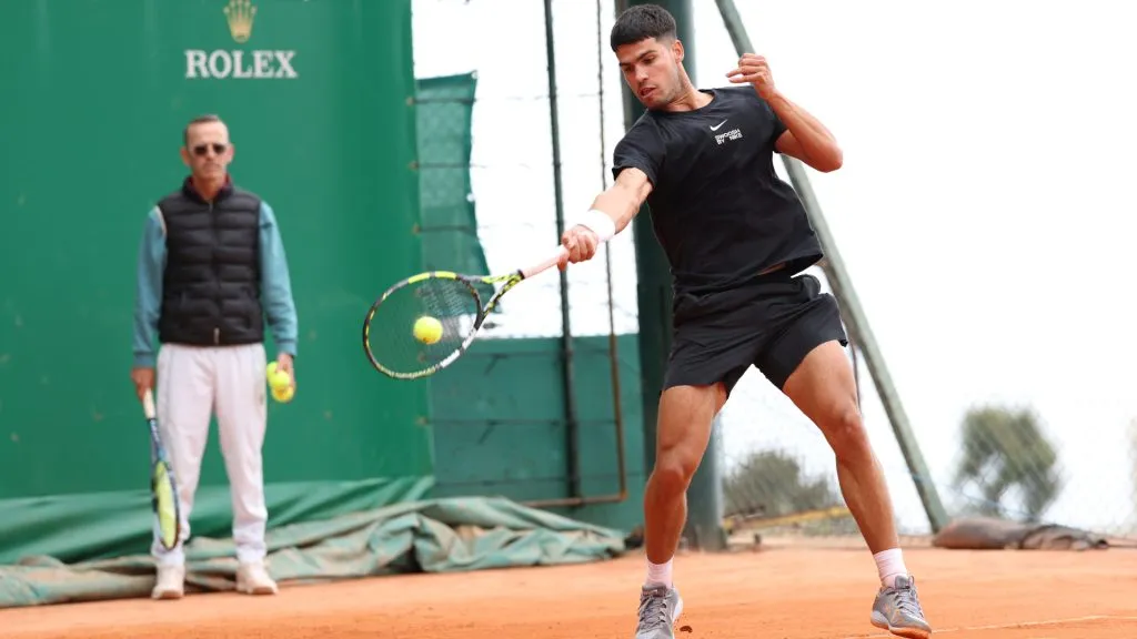 Carlos Alcaraz of Spain trains on the practice courts as coach Samuel Lopez looks on during day one of the Rolex Monte-Carlo Masters. (Clive Brunskill/Getty Images)