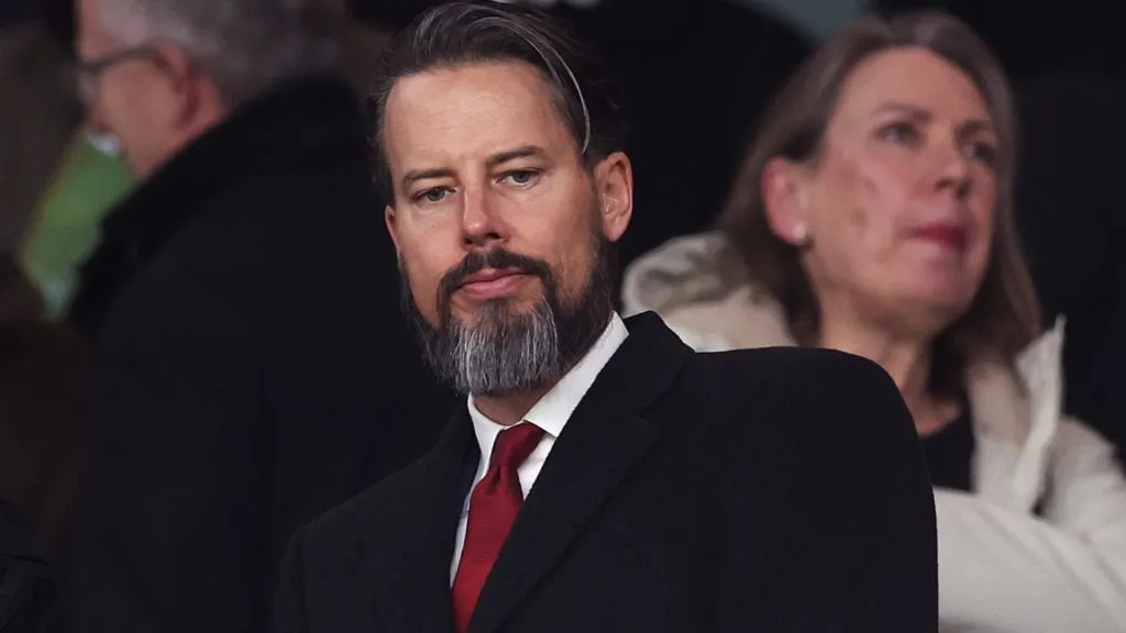 Josh Kroenke looks on