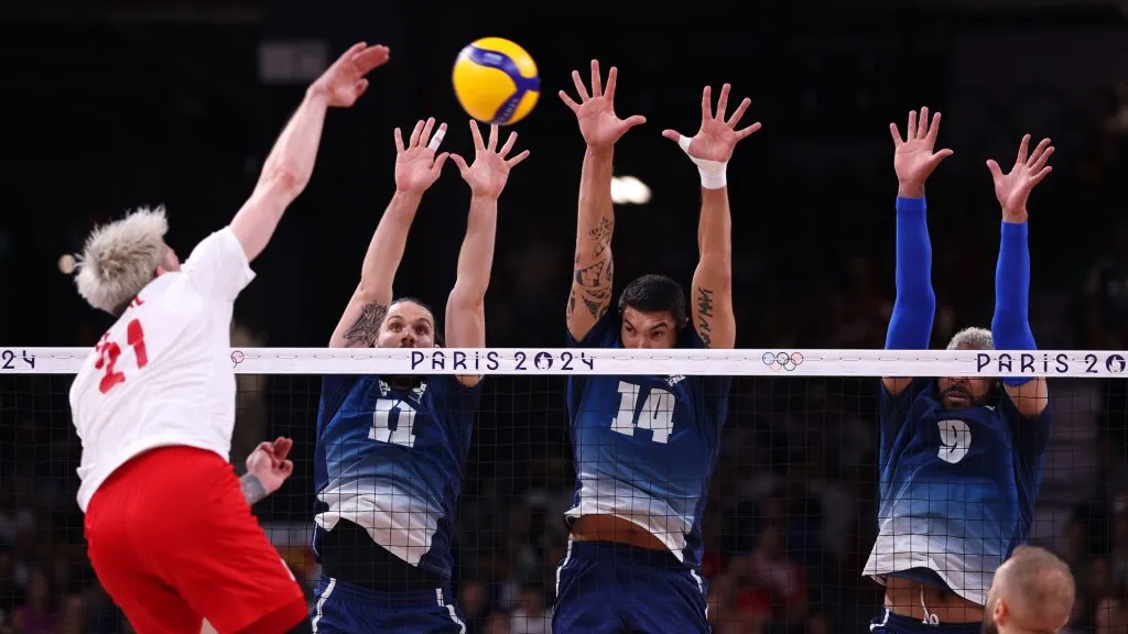 Antoine Brizard, Nicolas le Goff and Earvin Ngapeth defend against a shot from Tomasz Fornal during the Men’s Gold Medal Match on day fifteen of the Olympic Games Paris 2024. (Source: Sarah Stier/Getty Images)