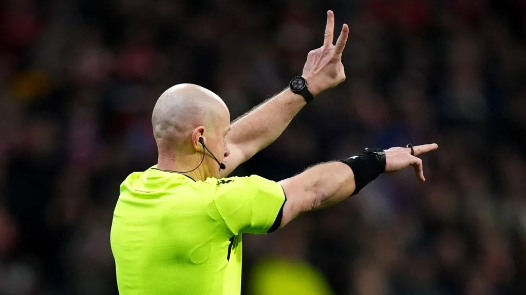 Referee Szymon Marciniak gestures as the second penalty kick for Atletico de Madrid, taken by Julian Alvarez (not pictured), is ruled out following a VAR Review. (Angel Martinez/Getty Images)