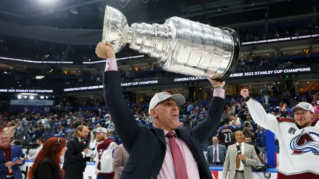 Head coach Jared Bednar of the Colorado Avalanche lifts the Stanley Cup after defeating the Tampa Bay Lightning 2-1 in Game Six of the 2022 NHL Stanley Cup Final at Amalie Arena on June 26, 2022 in Tampa, Florida.