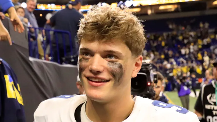 J.J. McCarthy interacts with fans after winning the Big Ten Championship against the Iowa Hawkeyes at Lucas Oil Stadium on December 02, 2023 in Indianapolis, Indiana.